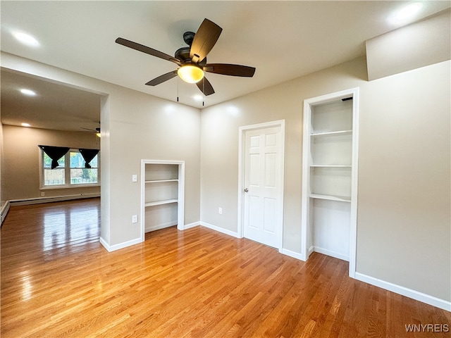 unfurnished bedroom featuring light wood-type flooring and ceiling fan