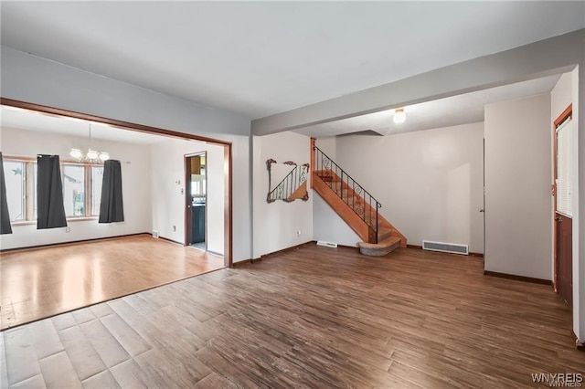 interior space with a chandelier and hardwood / wood-style flooring