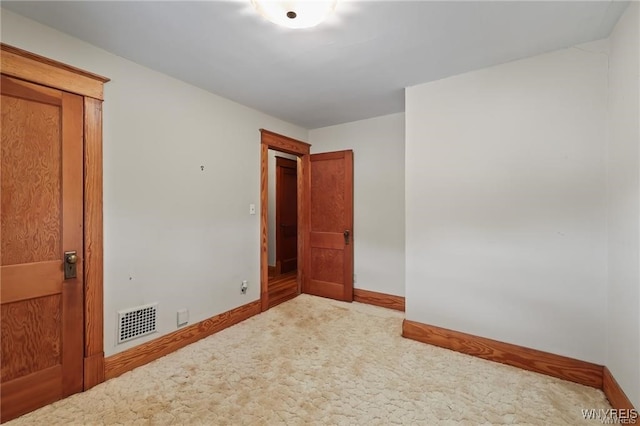 unfurnished room featuring carpet floors