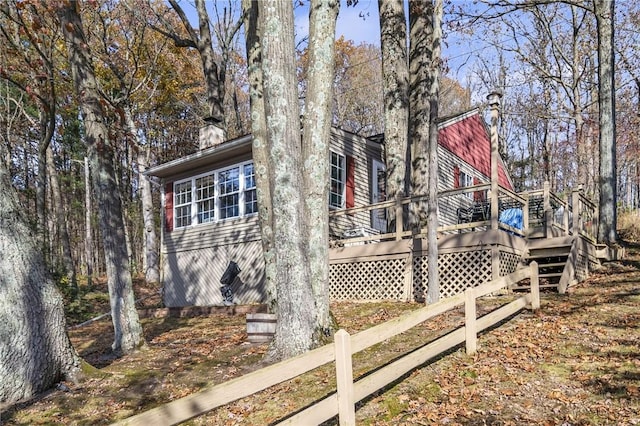 399 Fire Lane 34, Moravia, NY 13118 - view of property exterior featuring a chimney and a wooden deck