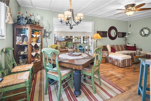399 Fire Lane 34, Moravia, NY 13118 - dining area featuring ceiling fan with notable chandelier and wood finished floors