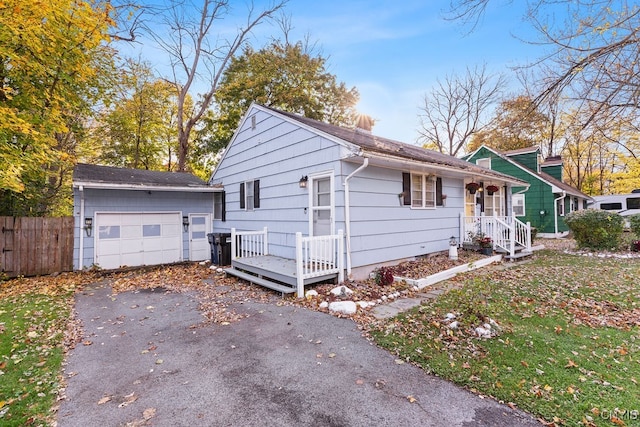 view of front of house with covered porch and a garage