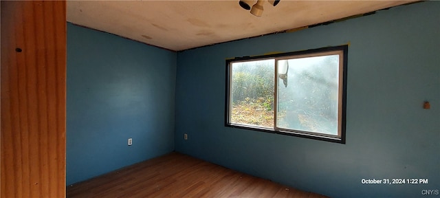 unfurnished room featuring hardwood / wood-style floors