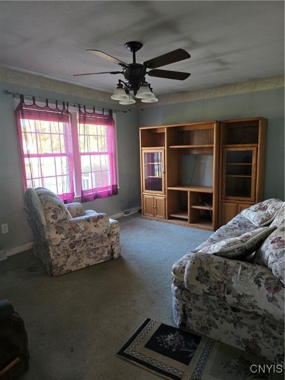 unfurnished living room featuring carpet floors and ceiling fan