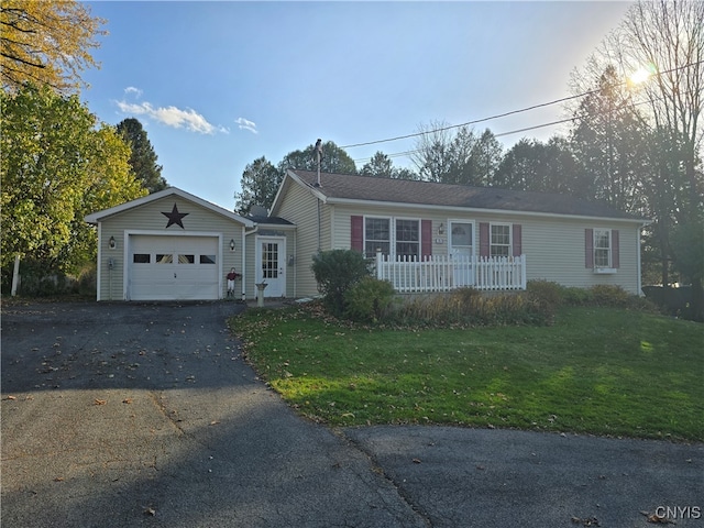 ranch-style home with a front lawn and a garage