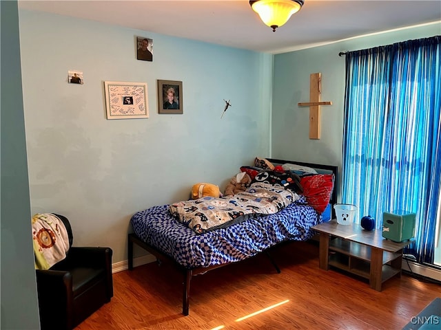 bedroom featuring hardwood / wood-style floors