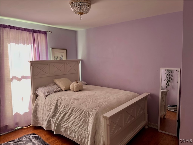 bedroom with hardwood / wood-style floors