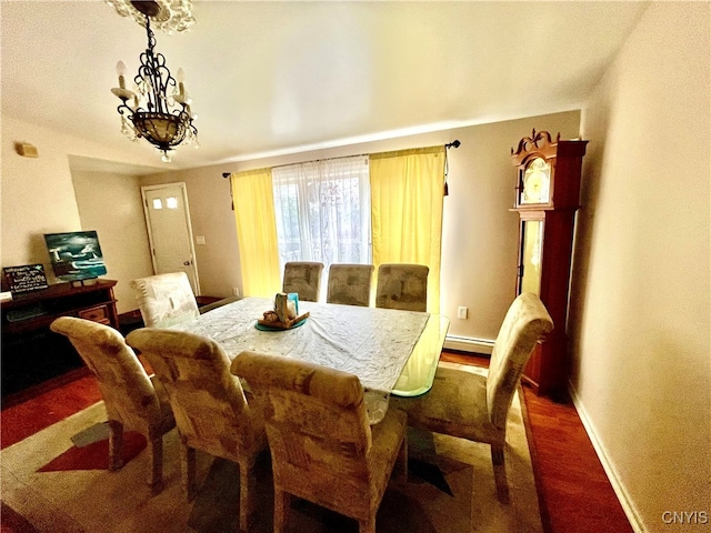 dining room featuring a baseboard heating unit