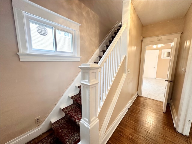 staircase featuring hardwood / wood-style flooring