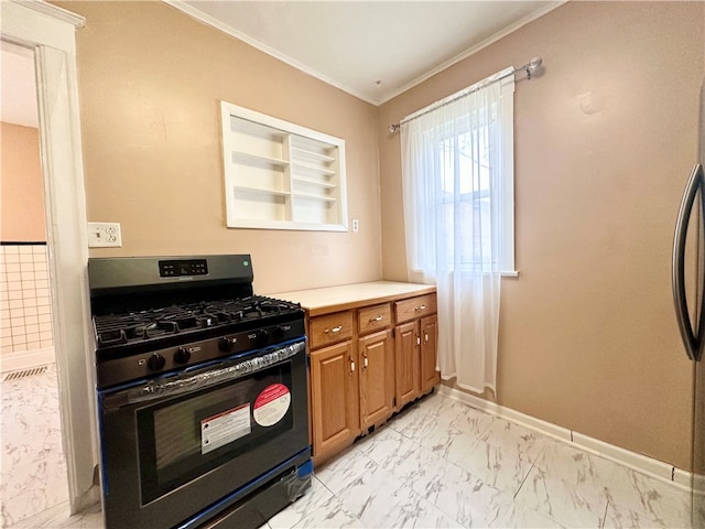 kitchen featuring crown molding and black gas range oven