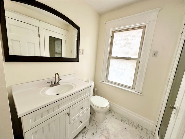 bathroom featuring vanity and toilet