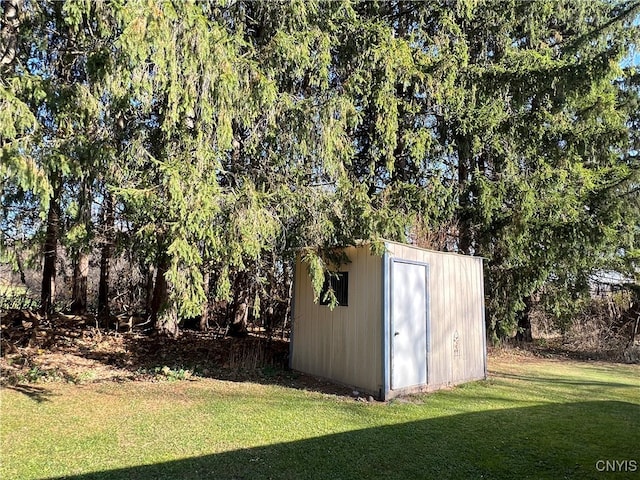 view of outdoor structure with a lawn