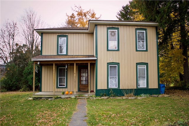 view of front of house featuring a front lawn and a porch