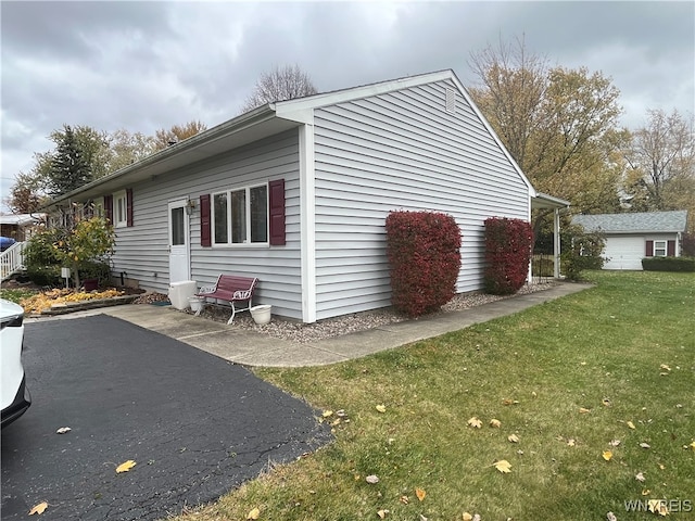 view of home's exterior with a lawn