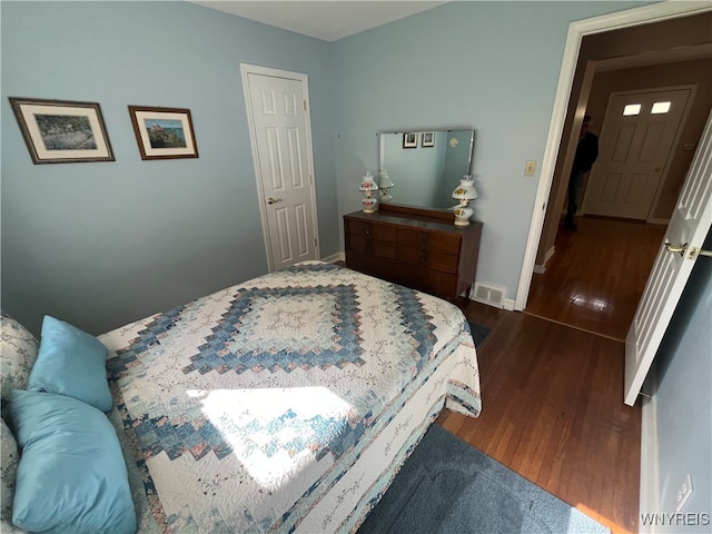 bedroom featuring dark hardwood / wood-style floors