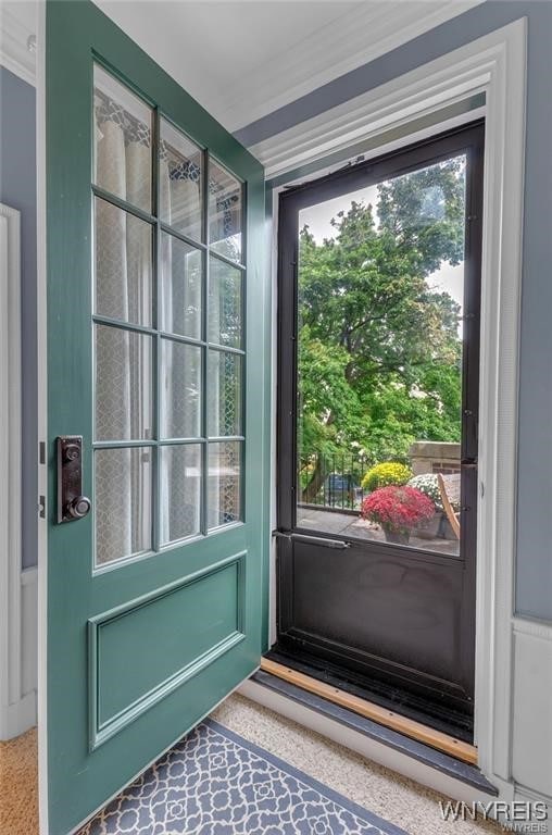 800 W Ferry St Unit 2Cc, Buffalo, NY 14222 - doorway with crown molding and speckled floor
