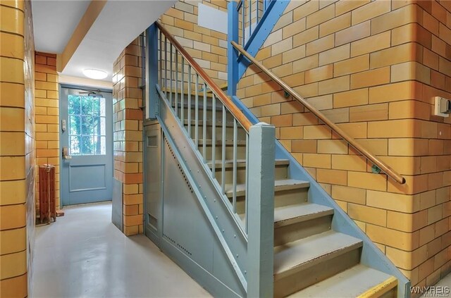 stairway with concrete floors