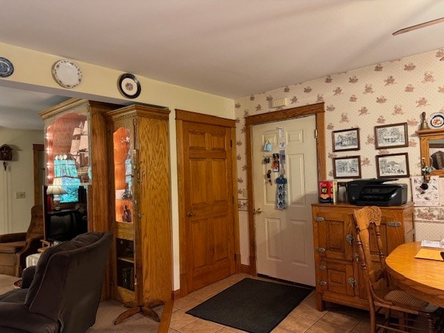 entryway with light tile patterned floors