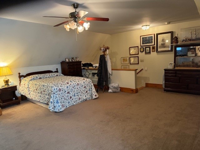 bedroom featuring vaulted ceiling, carpet flooring, and ceiling fan