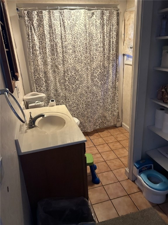 bathroom with vanity, curtained shower, and tile patterned floors