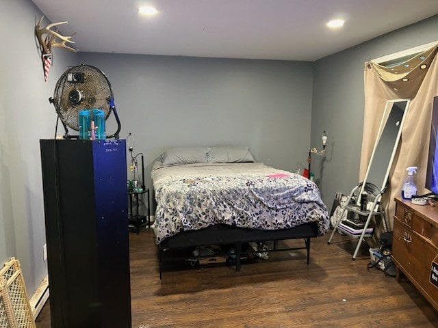 bedroom featuring dark hardwood / wood-style flooring