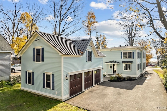 exterior space with a yard and a garage