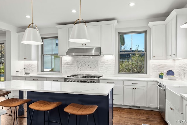 kitchen with white cabinets and decorative light fixtures