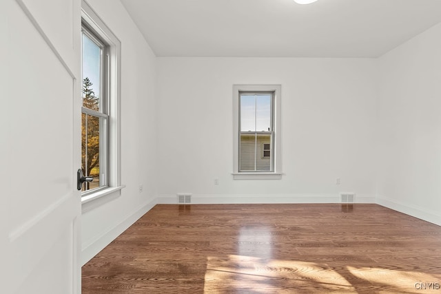 spare room featuring hardwood / wood-style floors