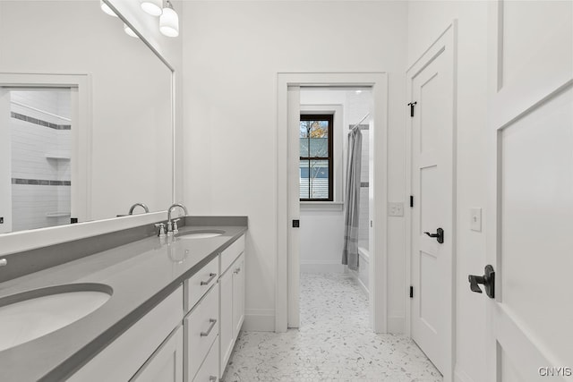 bathroom featuring shower / bath combination with curtain and vanity