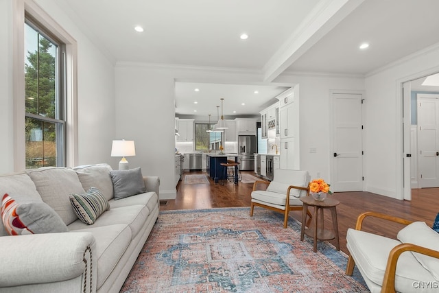 living room with crown molding and wood-type flooring