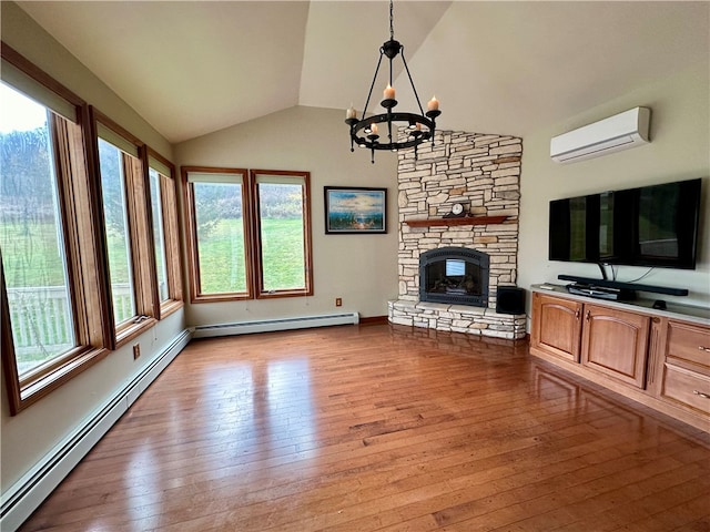 unfurnished living room featuring a baseboard radiator, a chandelier, a wall mounted AC, and light hardwood / wood-style floors