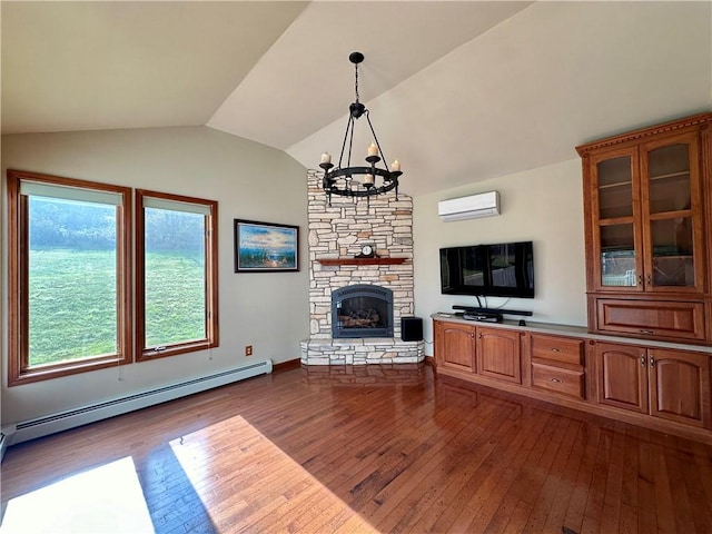 unfurnished living room with a baseboard heating unit, a fireplace, vaulted ceiling, a wall mounted AC, and dark wood finished floors