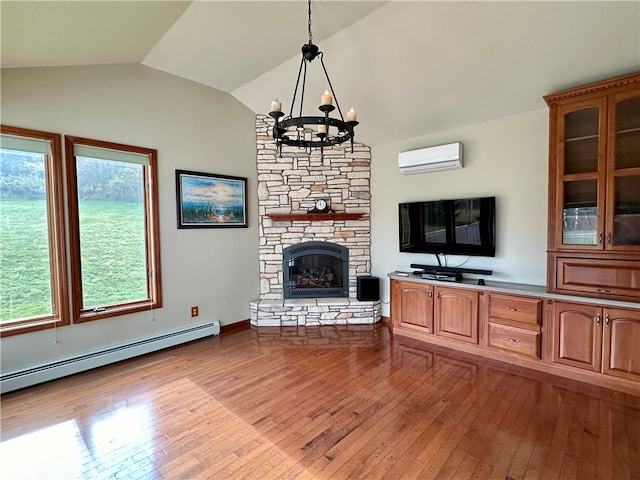 unfurnished living room featuring a baseboard radiator, light wood-type flooring, an AC wall unit, vaulted ceiling, and a notable chandelier