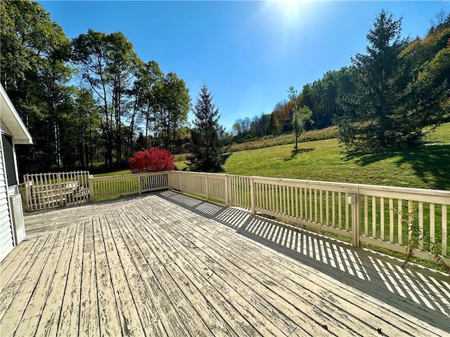 wooden deck featuring a yard