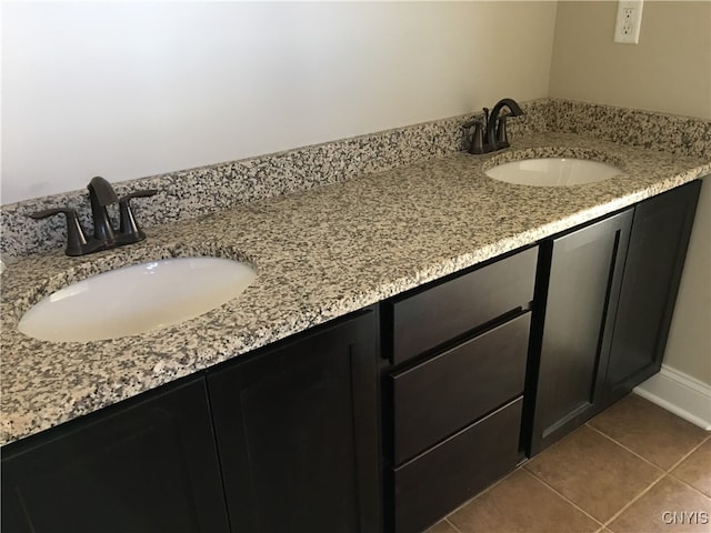 bathroom with vanity and tile patterned floors