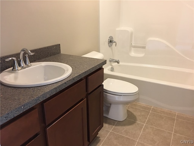 full bathroom with vanity, tub / shower combination, toilet, and tile patterned floors