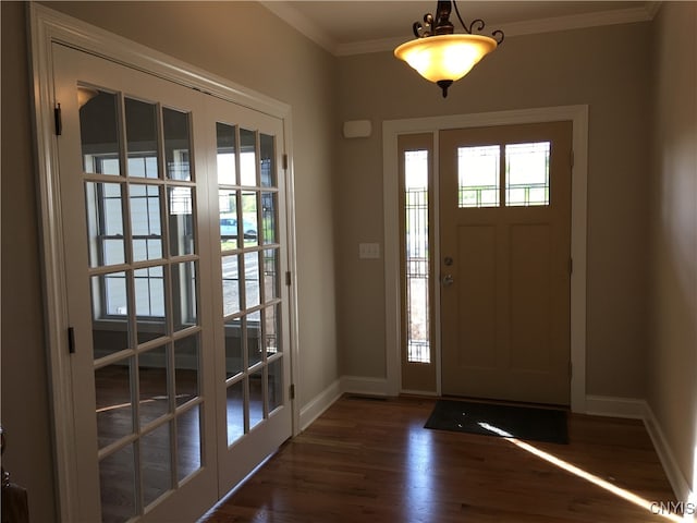 foyer featuring crown molding, french doors, and dark hardwood / wood-style flooring