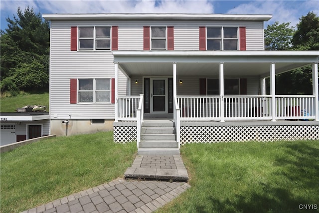 view of front of home with a front yard and a porch