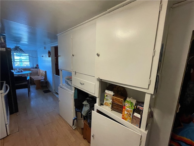 laundry room featuring light hardwood / wood-style flooring