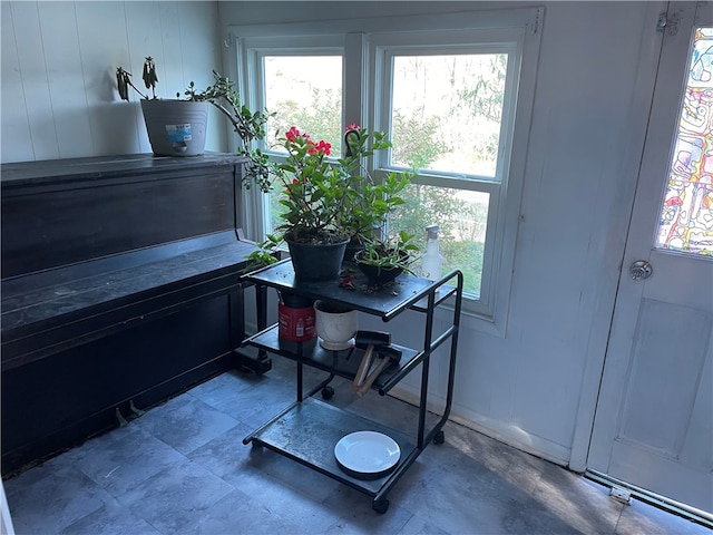 miscellaneous room featuring wooden walls