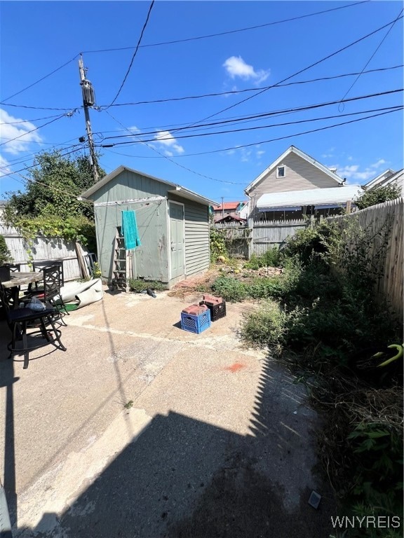 view of patio with a shed