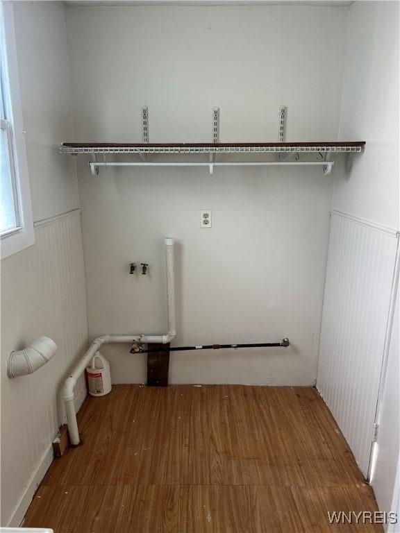 washroom with washer hookup and wood-type flooring