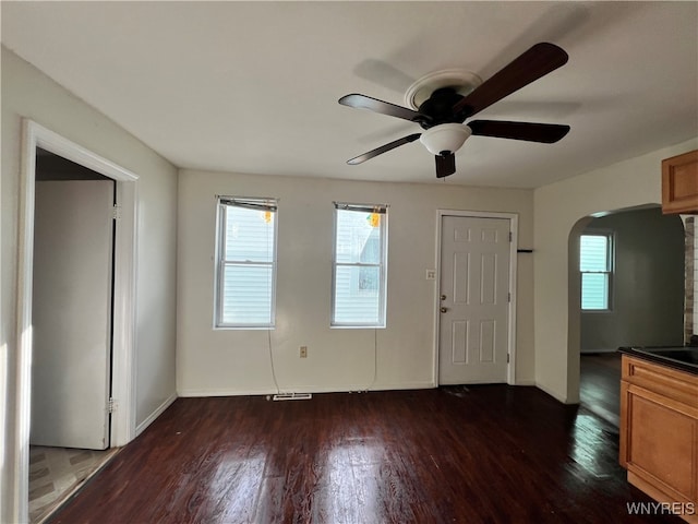 entryway featuring dark hardwood / wood-style flooring and ceiling fan