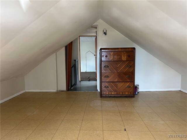 bonus room featuring vaulted ceiling