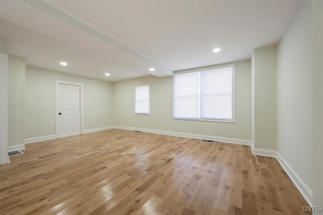 unfurnished room with light hardwood / wood-style flooring