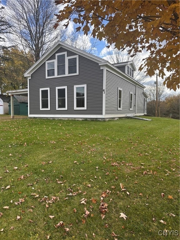 view of home's exterior with a yard