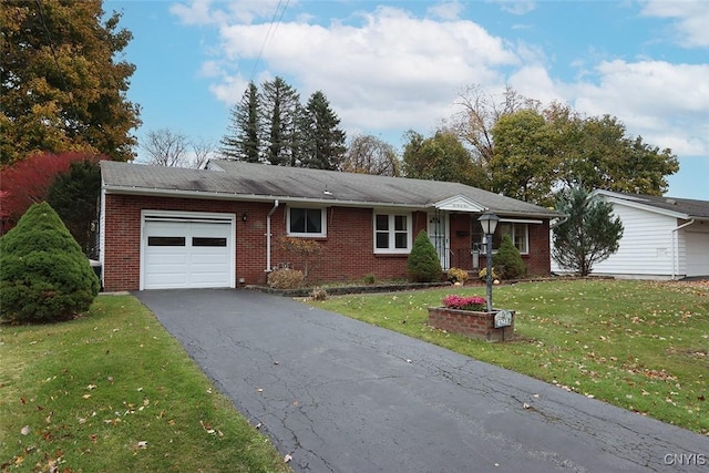 single story home with a front yard and a garage