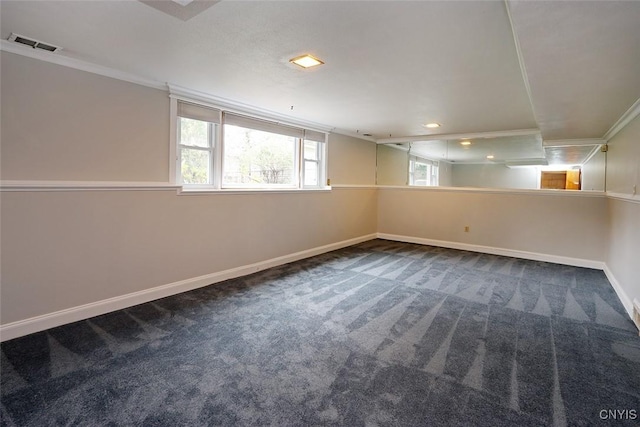 basement featuring crown molding and carpet