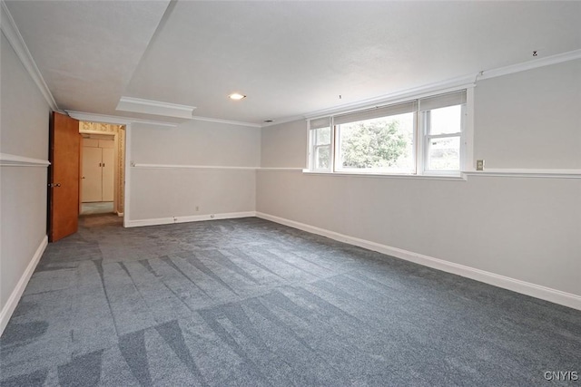 empty room featuring carpet flooring and crown molding