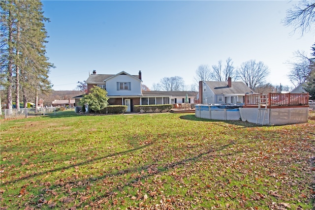 view of yard featuring a swimming pool side deck